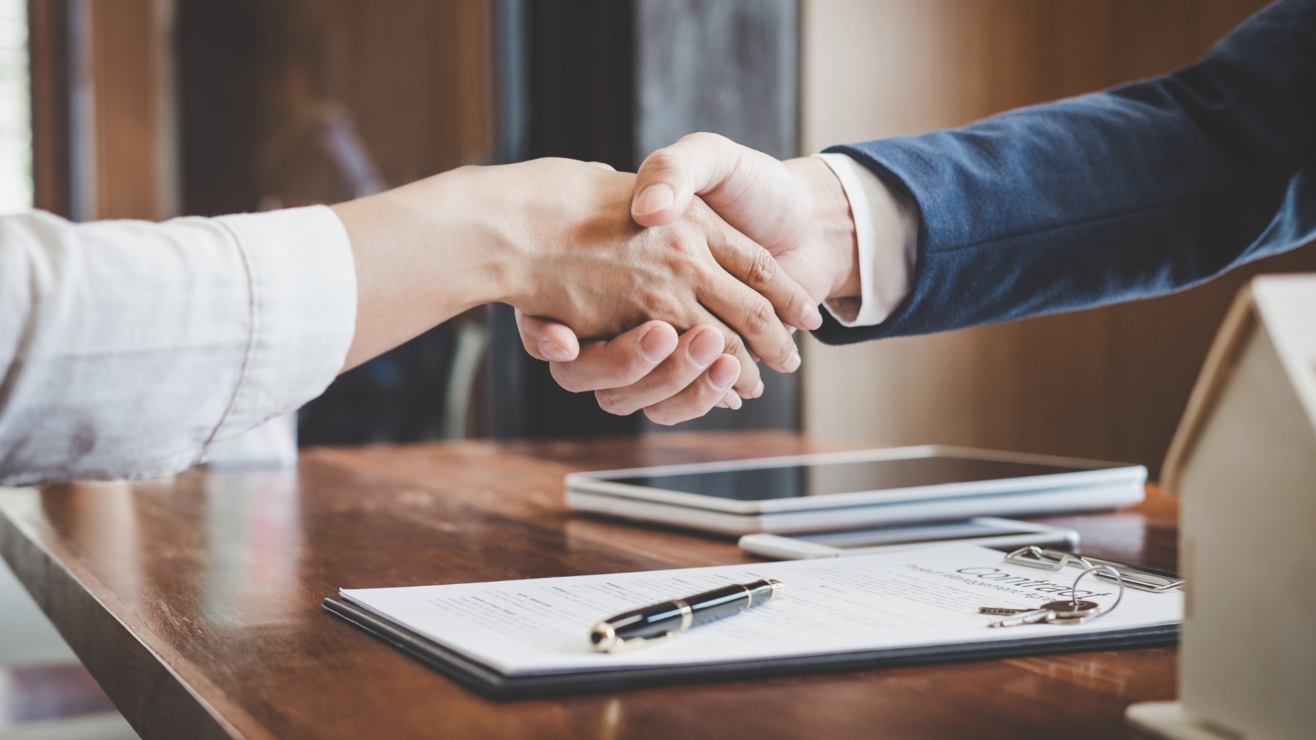 A close up of two people shaking hands