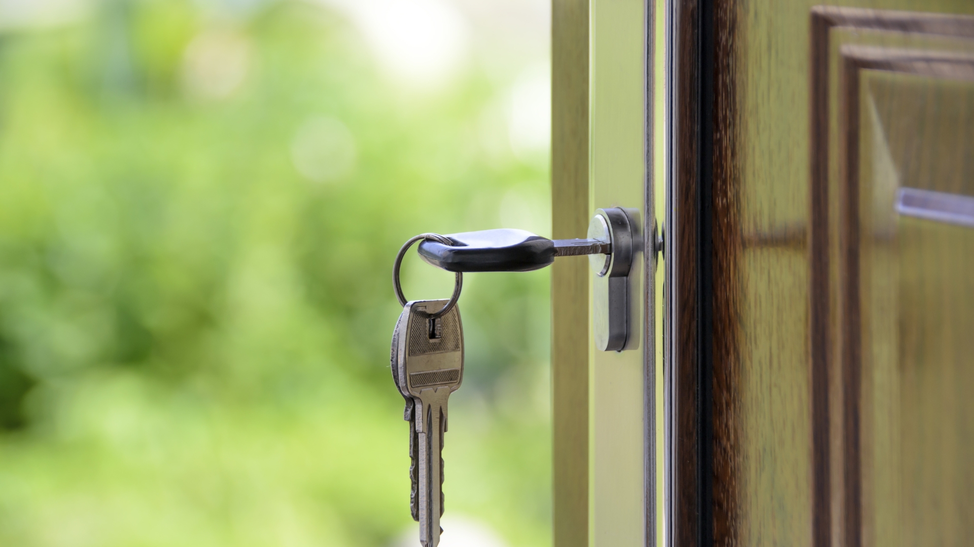 A door handle with a key attached to it